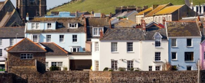 Image of Ilfracombe Harbour showing boats and capstone hill in background