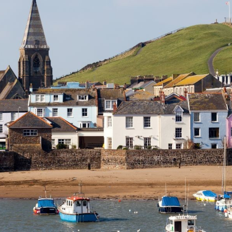 Image of Ilfracombe Harbour showing boats and capstone hill in background