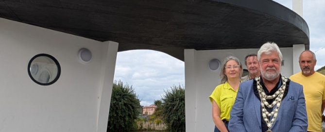 Mayor of Ilfracombe standing outside new bus stop and toilets at St James Place Ilfracombe
