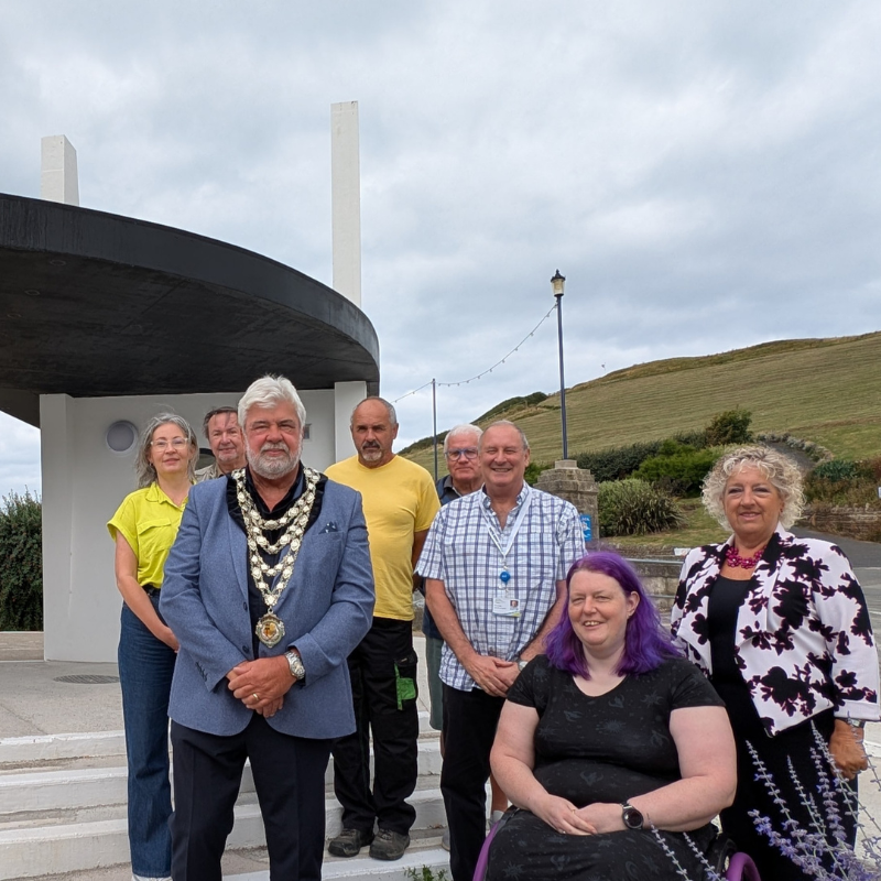 New Ilfracombe toilets and bus shelter shows picture of town and distrcit councillors standing in front of new toilet block