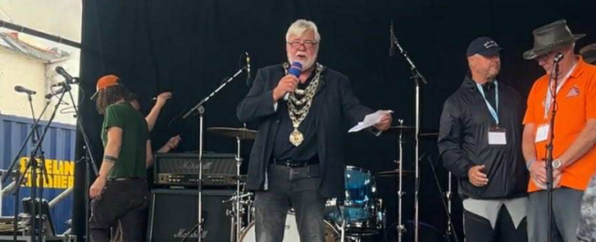 Image of Cllr Mark Fay on stage with Mic in hand at the Sea Ilfracombe Maritime Festival 2025